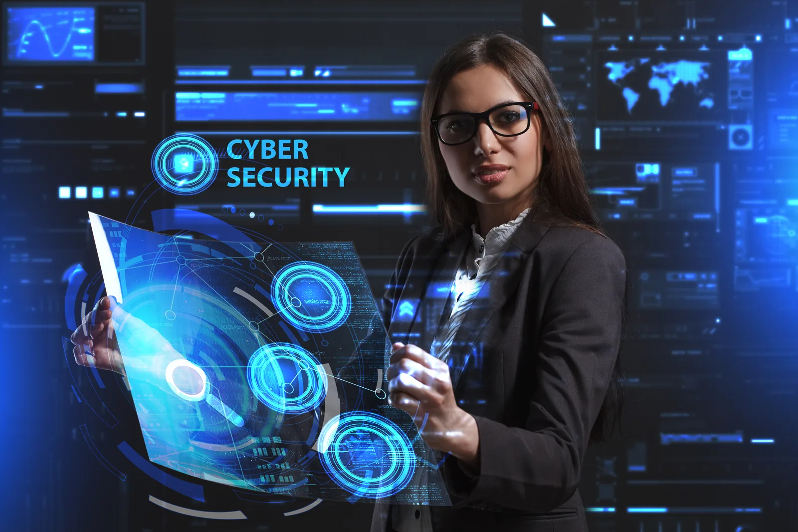Security analyst working across cyber security screens