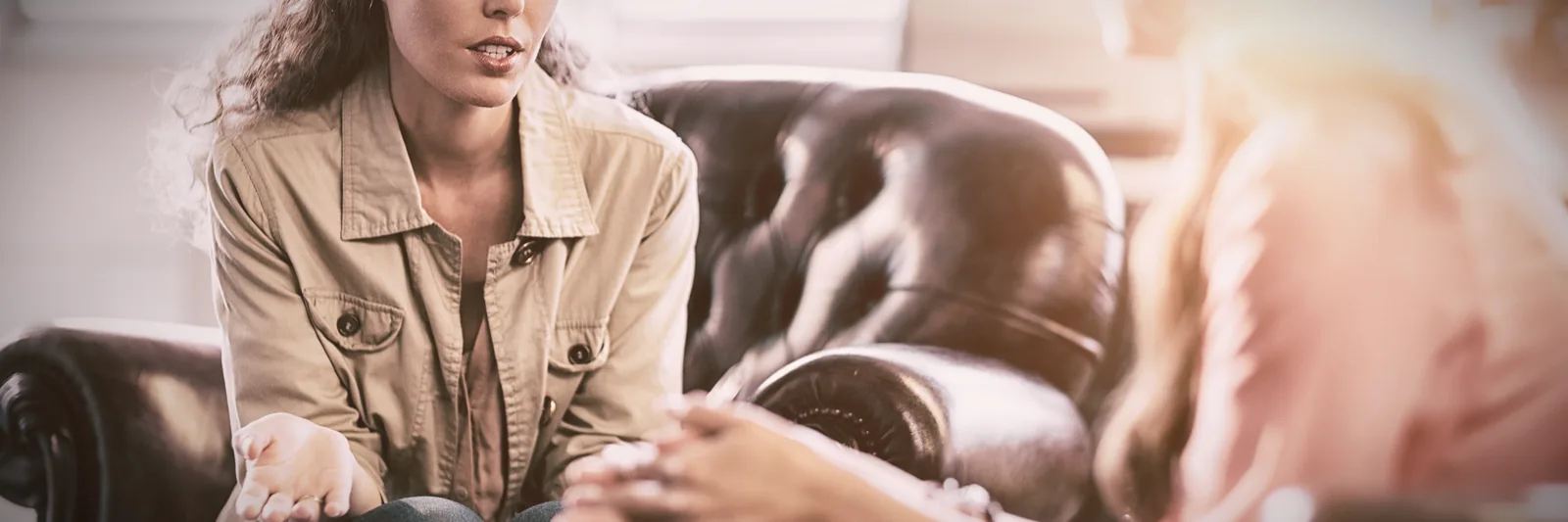 Psychologist taking notes during a therapy session