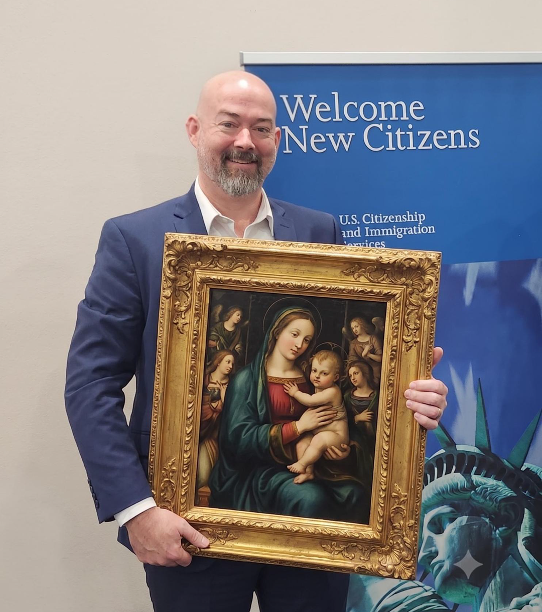 Thomas Cairns, holding a big picture.