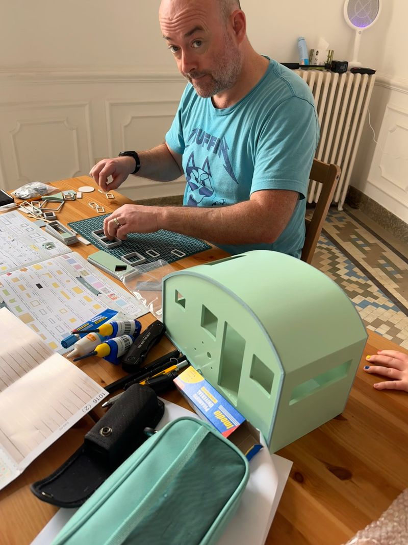 An image of Tom Cairns putting together a complex model